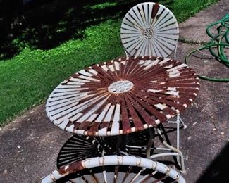 iron table and 2 chairs
