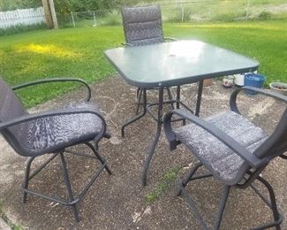 glass top table and 3 chairs