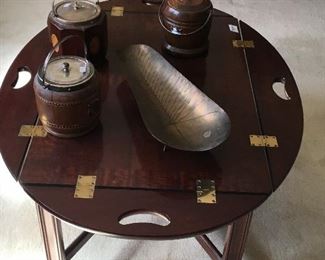 Round occasional table with antique humidors