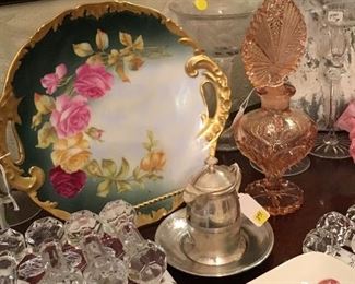 Pretty antique plate with handles, knife rests, and tall perfume bottle