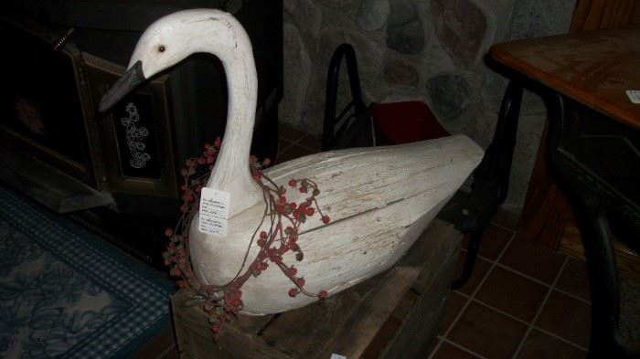 Wood swan decoy with H&S initials on the bottom