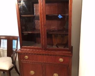 Lovely, small and slender federal style china cabinet