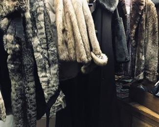 At least 12 fur coats all different ages
