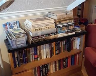 Bookcase filled with ary and coffee table books