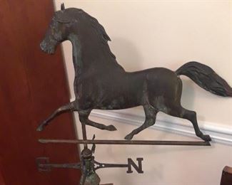Antique weather vane of a trotting horse