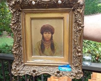 Oil on canvas in elaborate frame. Subject is Native American.
