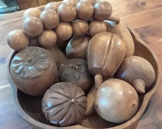 Wood bowl filled with carved wood fruit