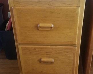Solid oak file cabinet on wheels. 2 drawers for hanging files