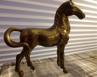 Brass horse sculpture on lucite base