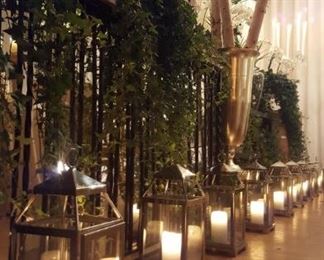 Hundreds of Pottery Barn lanterns in small, medium, large and extra-large sizes. Iron, marble and mirror bars. Dozens of 8', 10' and 12' birch and bamboo poles. Asian rice paper screens,  38" and 45" silver regent trophy urns.