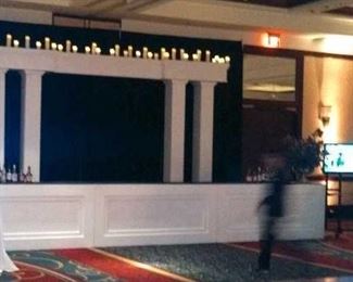 Wood-trimmed bar panels, architectural structures, candle walls and bar backs. Custom pipe and drape hardware. Faux candles, wax candles and lighting accessories. 