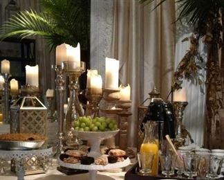 Buffet accessories. Cake plates and tiered food platters in gold, silver and porcelain. Hundreds of multi-tiered, wooden candlesticks. Wooden bowls, platters and trays. 