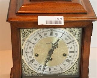 Howard Miller mantel clock; may need cleaning or repairs. Has key inside back panel. Comes with instructions.