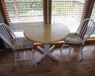 Adorable drop-leaf table and two chairs.