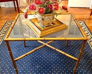 Faux bamboo glass top table.