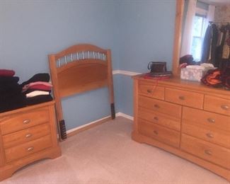 Nice bedroom, with twin bed, nightstand, dresser with mirror