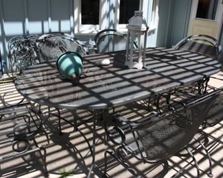 Wrought iron patio table with 6 chairs