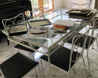 Small wrought iron vintage patio table with six chairs