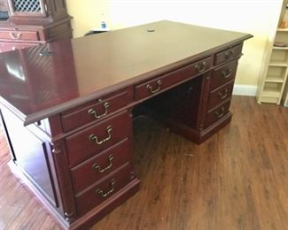 The Executive Desk has locking file drawers, computer cord portholes. 