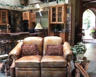 Reclining Leather Loveseat with  a Burl Wood and a Grapevine End Tables