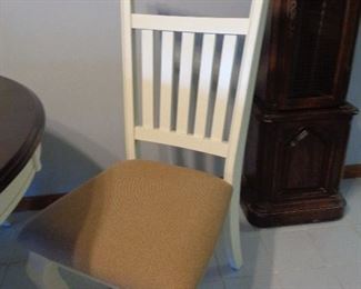 closeup of chairs that go with round dining table
