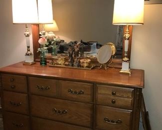 Vintage solid oak bedroom--wood dresser with framed mirror, queen-size bed and non-matching oak nightstand.