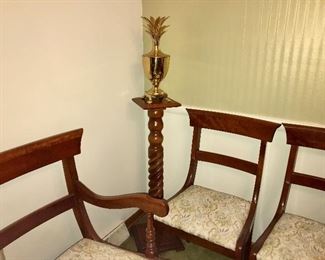 Vintage cherry barley-twist pedestal, solid brass lidded pineapple decor and three of the dining chairs.