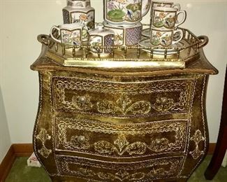 Gold leaf bombe chest with Made in Japan vintage tea set on brass gallery tray.