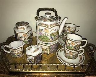 Gold leaf bombe chest with Made in Japan vintage tea set on brass gallery tray.