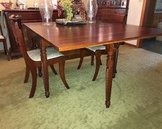 Fabulous vintage solid cherry dining group--drop leaf table with 6 chairs, corner china cabinet and server. All pieces are in excellent condition.