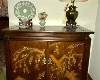 Lovely Asian-themed credenza with hand painted embellishment, lamp and Jasper ware by Wedgwood.