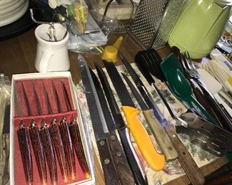 Kitchen full of great items--dinnerware, flatware, bowls, serving pieces, utensils, glassware, and small appliances.