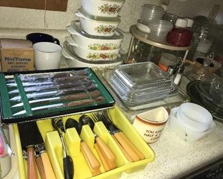 Kitchen full of great items--dinnerware, flatware, bowls, serving pieces, utensils, glassware, and small appliances.