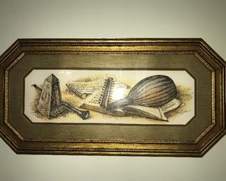Assorted framed wall decor.
