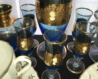 Decanter set--blue and gold with cameo embellishment.