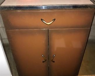 Vintage "copper tone" metal cabinet with formica top.