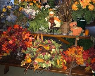 Assorted floral arrangements and wreaths.