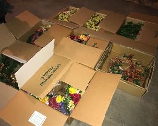 Assorted floral arrangements and wreaths.