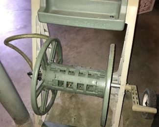 Garden hose carrier.