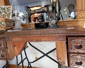 Antique White sewing machine with oak cabinet