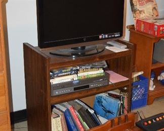 Flat Screen Television, Stand, Books, Atari Gaming Unit