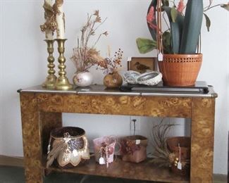 Sofa/hallway table w/ lots of pretties.  Brass candlesticks w/ dragon candles are from the Philippines or Singapore.