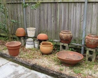 Large clay flowerpots plus lots and lots of smaller clay and plastic flower pots & saucers