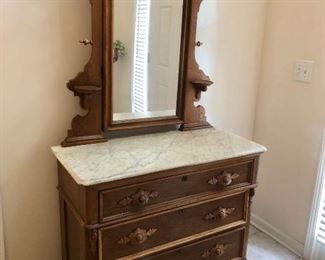 This marble-topped chest with mirror traveled by wagon train to Texas in the late 1800's.