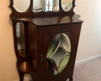 Unique and extraordinary Art Nouveau Sheet Music Cabinet with stained-glass front and three-piece beveled mirror.  