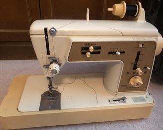 Singer Touch & Sew machine.  This was the top of the line in the 1960's.  Sturdy and runs great! 