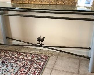 Unique hall table with bronze birds and glass top.  