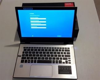 Toshiba Satellite Radius laptop, like new, in box.