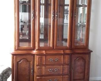Beautiful lighted china cabinet.