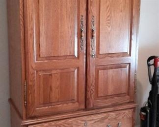Oak armoire/TV cabinet with 4 drawers (one felt-lined drawer for jewelry) and mirror.